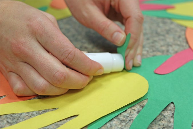 placing glue on hands 