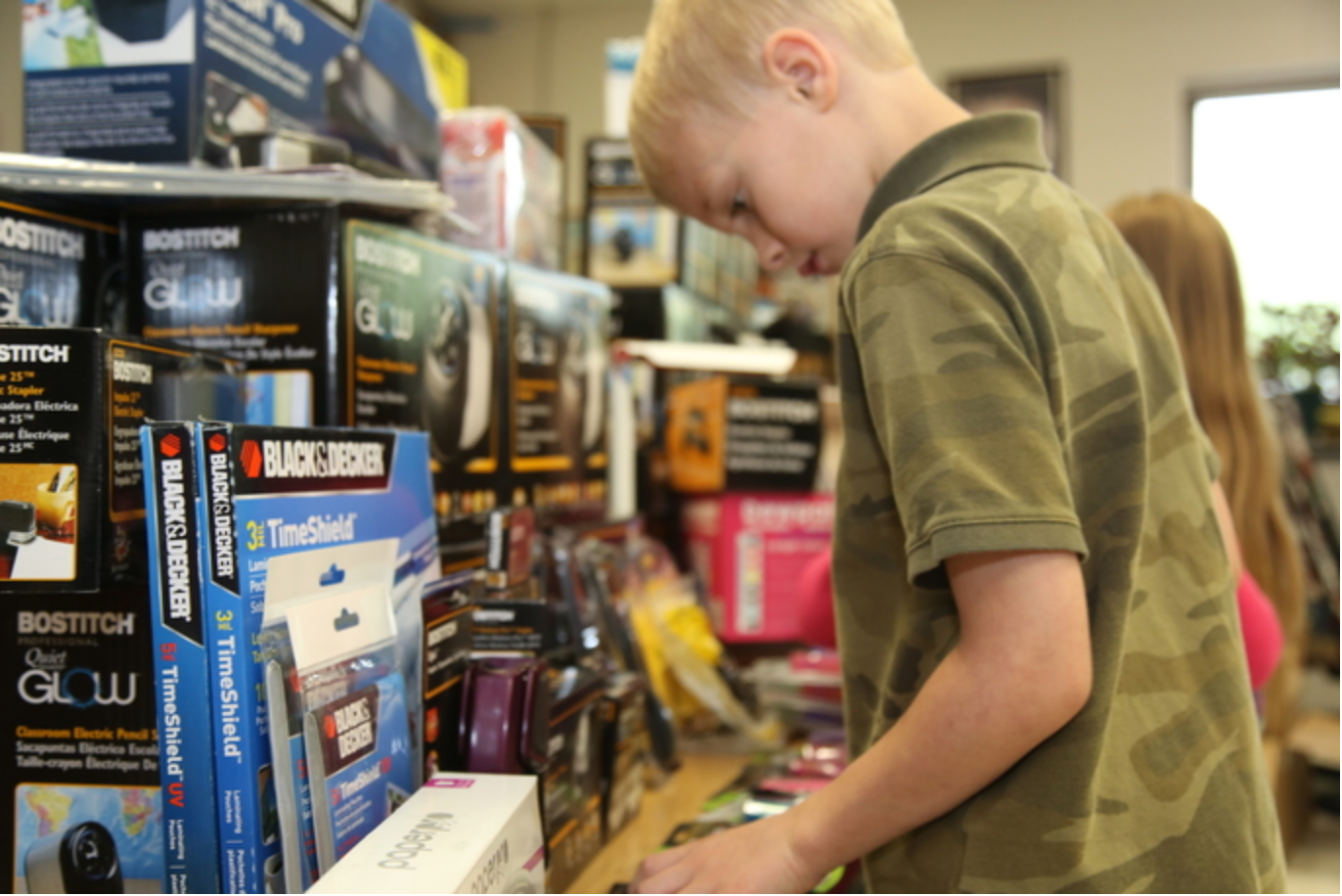 kid looking at bostitch school products