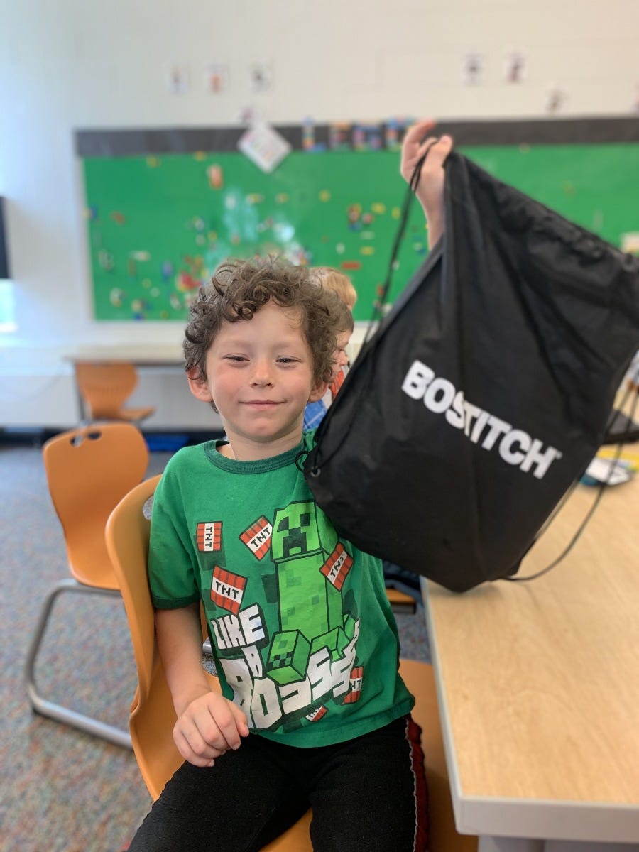 student holding Bostitch bag