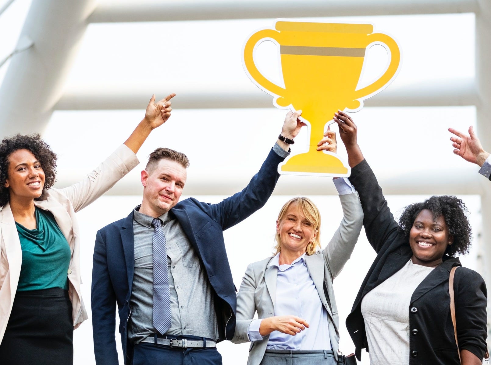 work team holding a reward