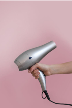 blow dryer in hand